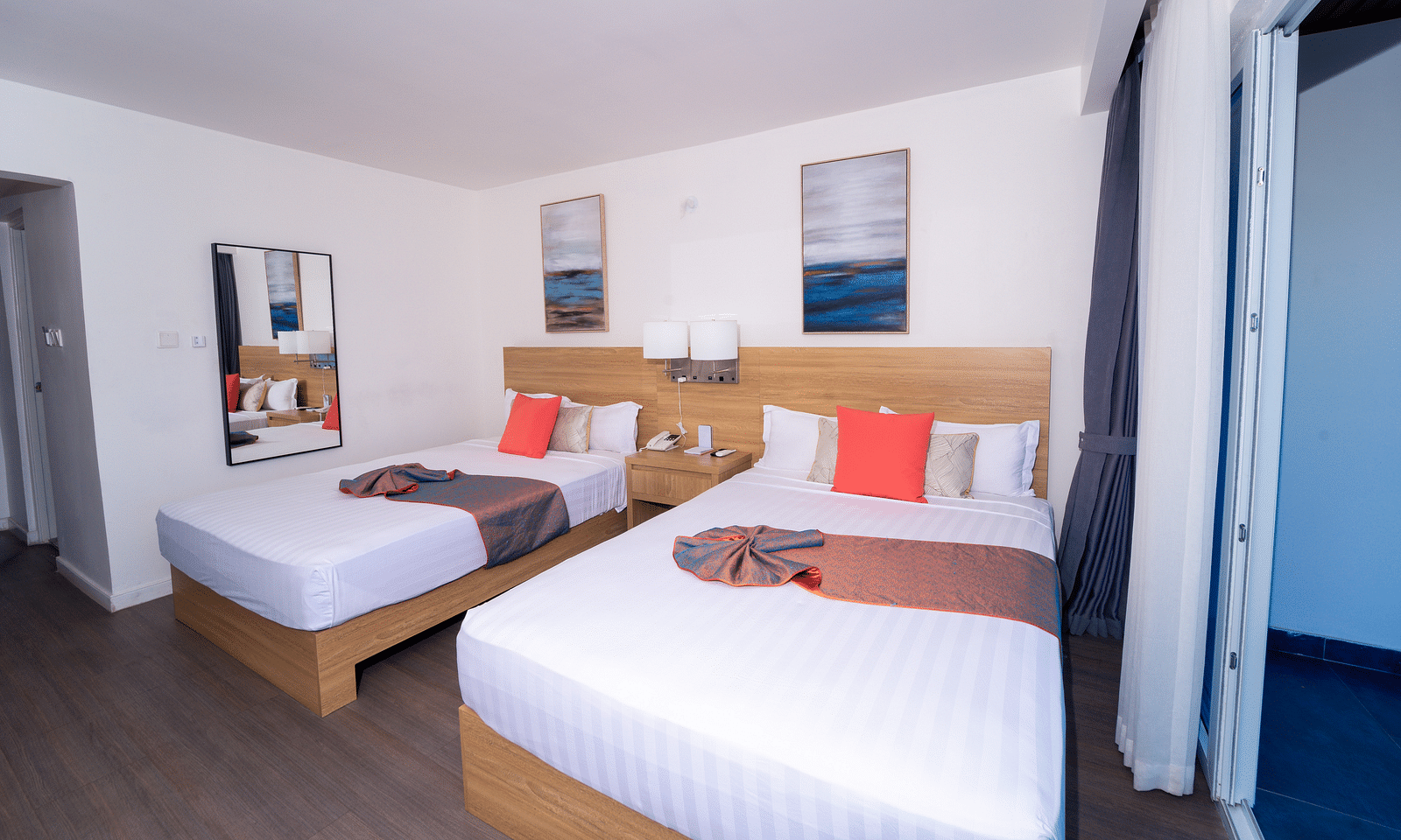 An image of a Montego Bay hotel room with double beds and a balcony - Hotel 39, Jamaica (Montego Bay)