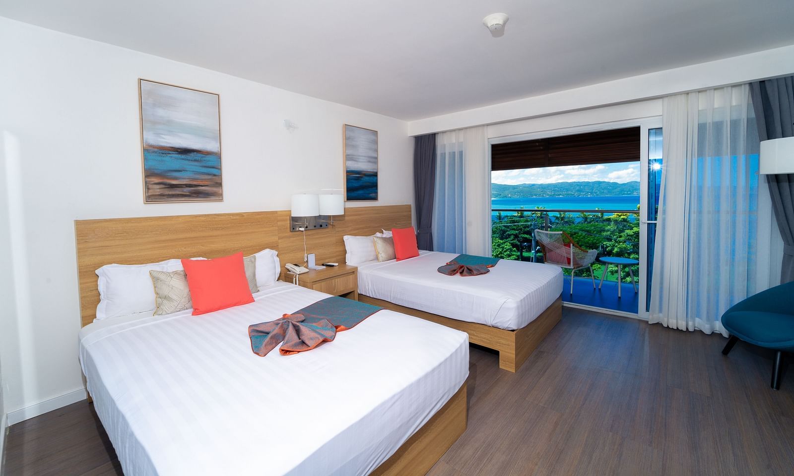 An image of a hotel room in Montego Bay with a balcony that offers the view of the shore - Hotel 39, Jamaica (Montego Bay)