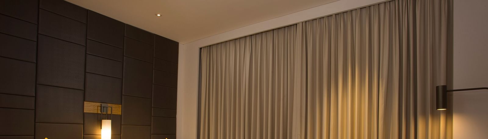 a bedroom with two single beds and a sofa - Hotel Fountain Tree By TGI - JP Nagar, Bangalore