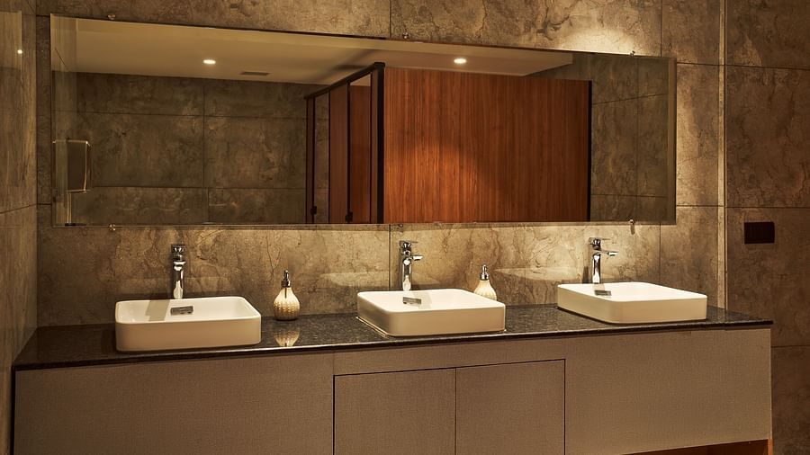 wash basins in the bathroom of the lobby at Triptam Hotel, Vrindavan