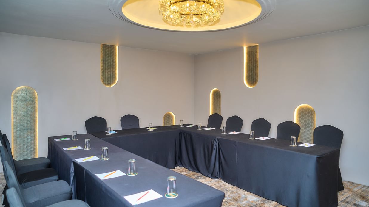 Conference room with U-shaped seating at Voyage Milestone Hotel and Banquet.