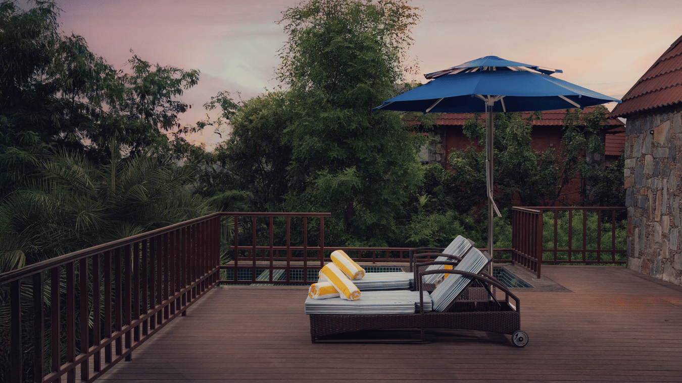 Patio at terrace with greenery in the background at the Ananta Udaipur.