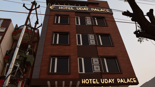 A scenic exterior view of Hotel Uday Palace, the best hotel in Varanasi, set against the sky.