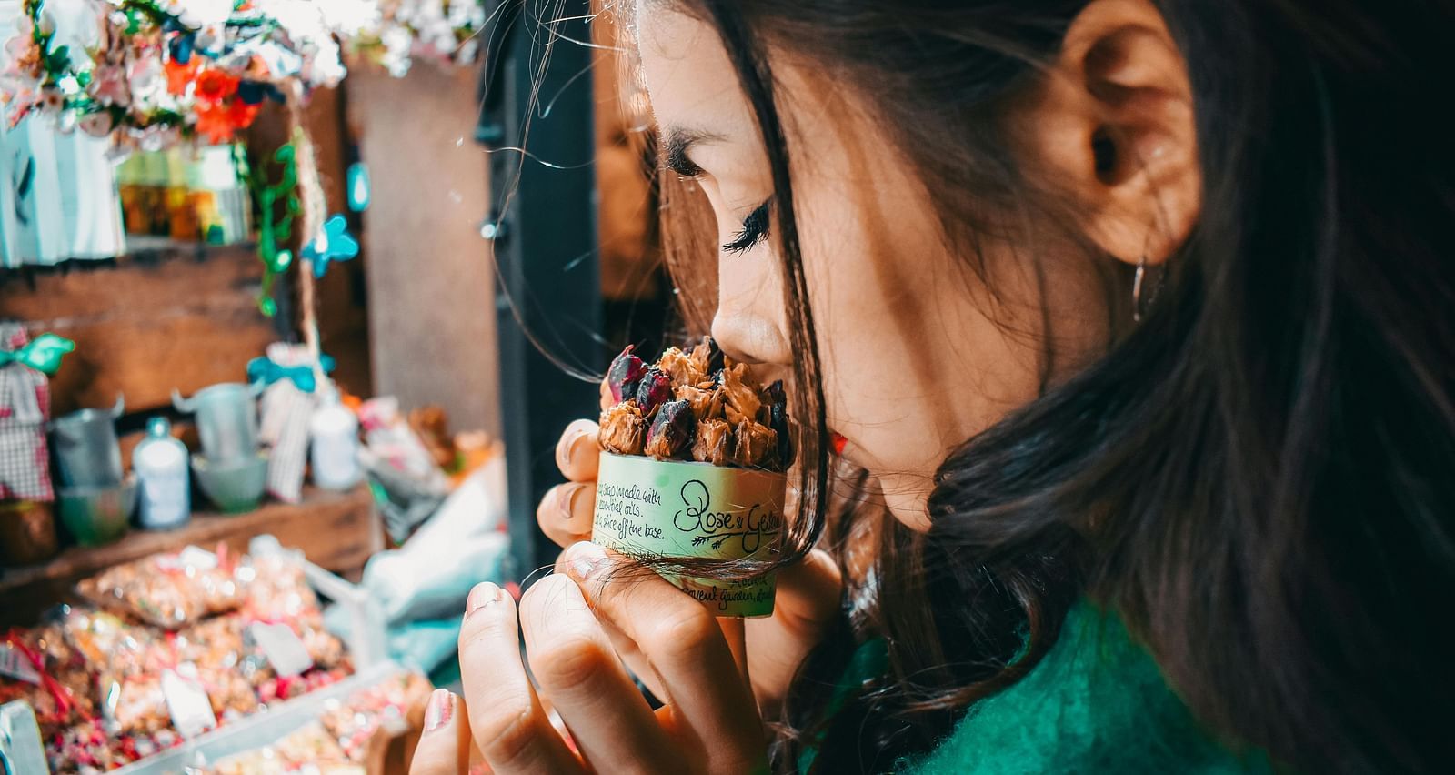 An image of a women sniffing the aroma of a product used in spa treatment