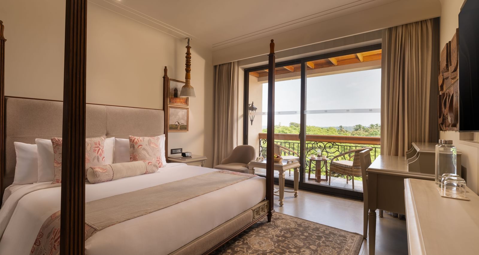 A corner-view shot of the Classic Room (Diwa) featuring a double bed along with a patterned rug placed in front of it at The Evren, Vagator.