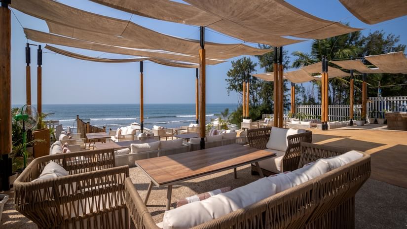 full view image of the saz on the beach restaurant at sibaya beach resort, morjim beach with covered seating arrangements