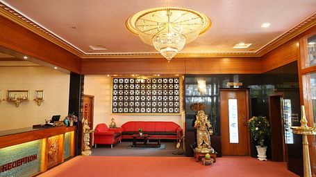 image of the lobby at The Grand Krishna Rooms with a beautiful chandelier hanging from the ceiling