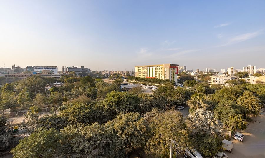 Scenic city view with lush greenery and buildings, seen from Hotel Bawa, Gurgaon.