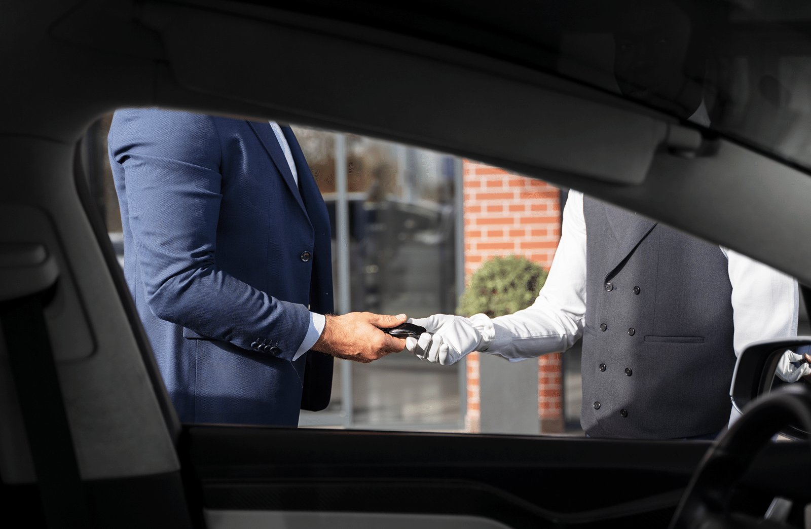 men-holding-car-key-side-view