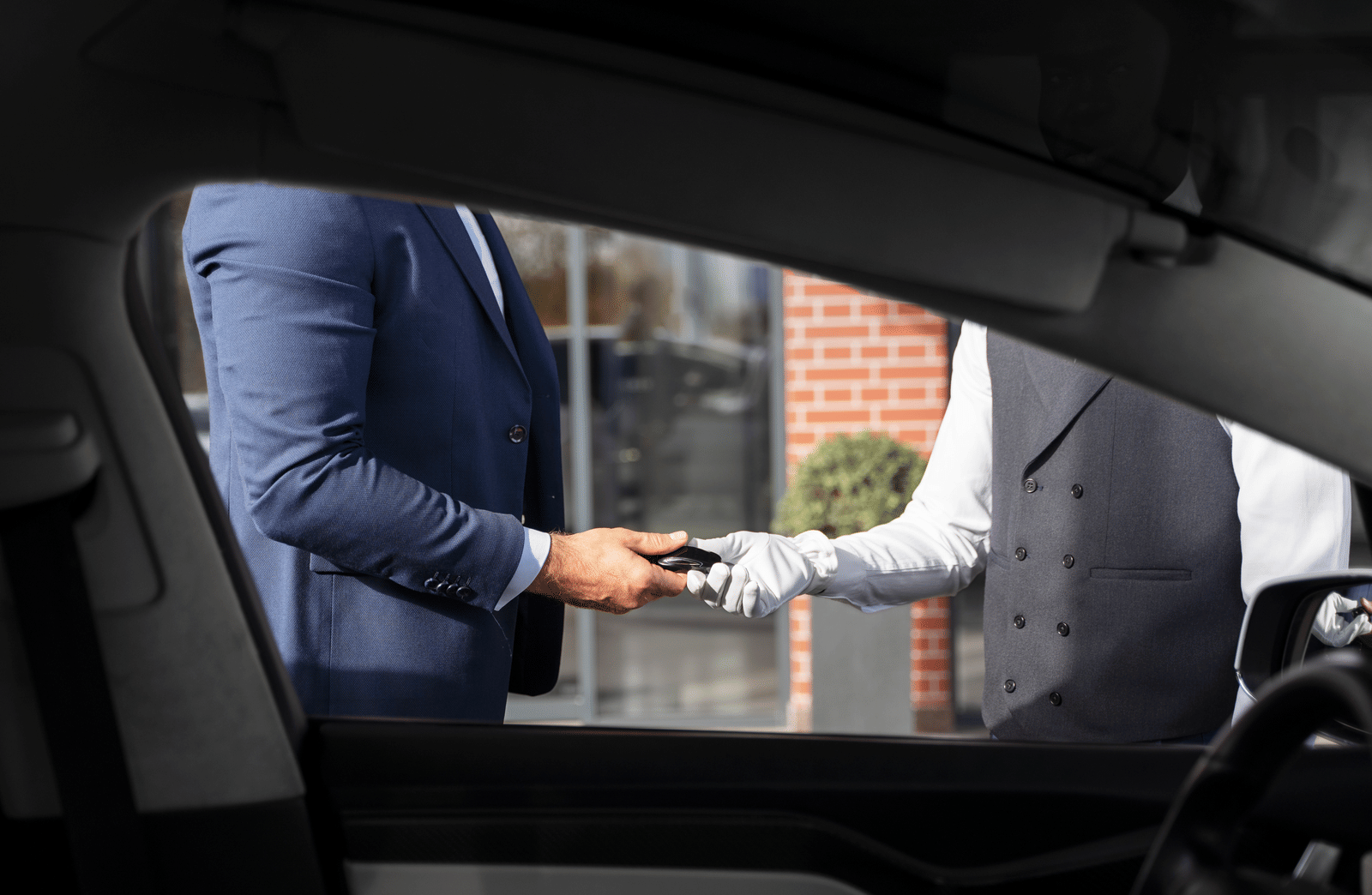 men-holding-car-key-side-view