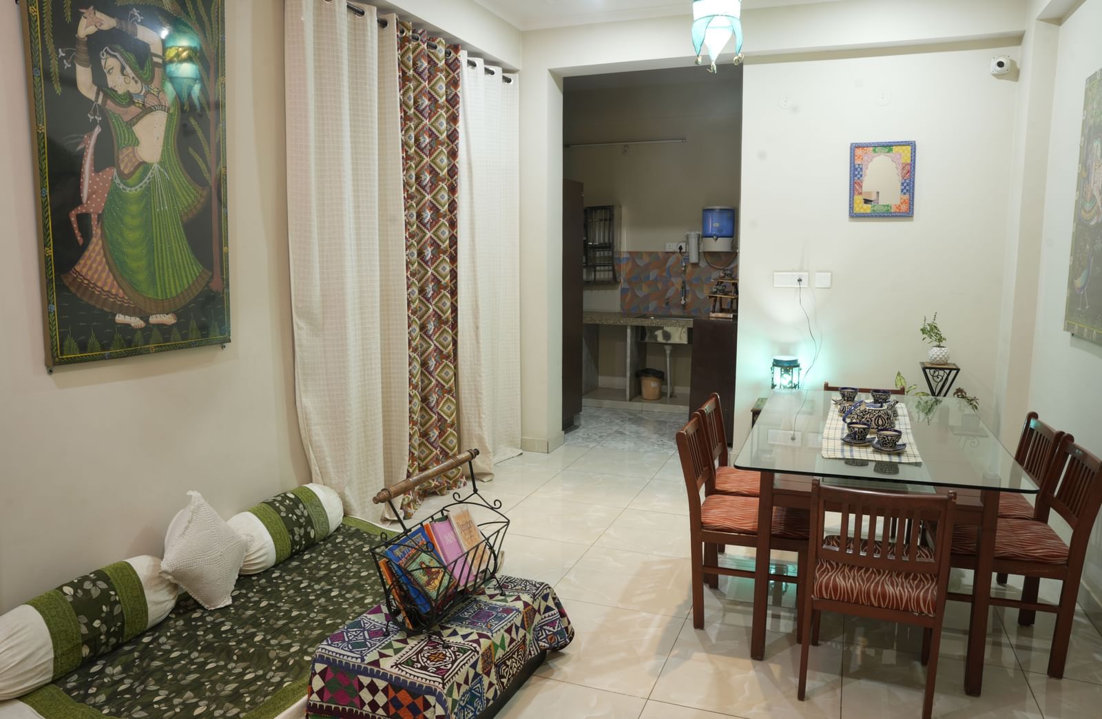 Rooftop terrace with numerous potted plants arranged along the edges of the open space at Jaypore360 Homestay in Jaipur.
