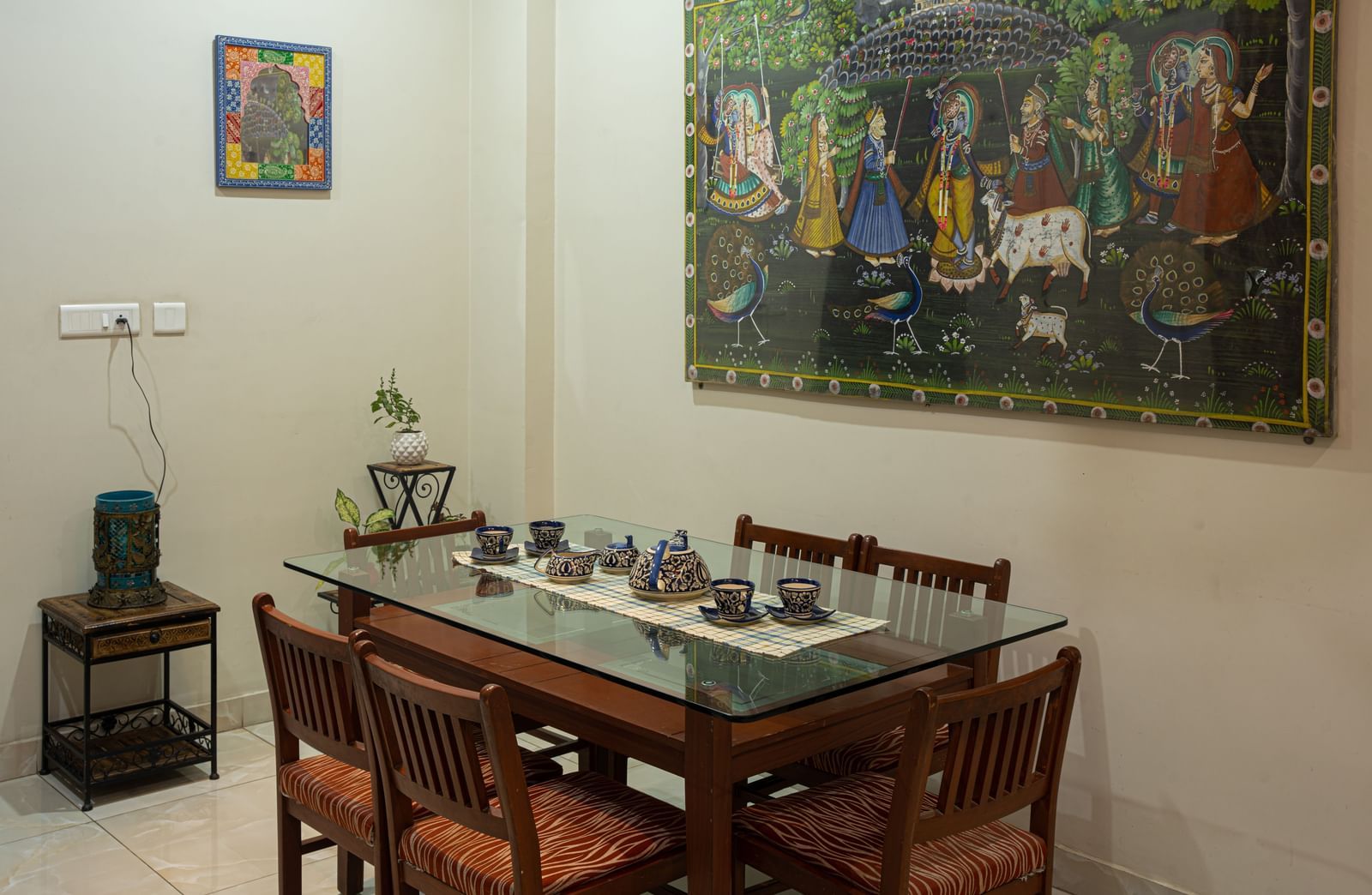  Hands and gaming chips rest on a roulette table surface at Jaypore360 Homestay in Jaipur.