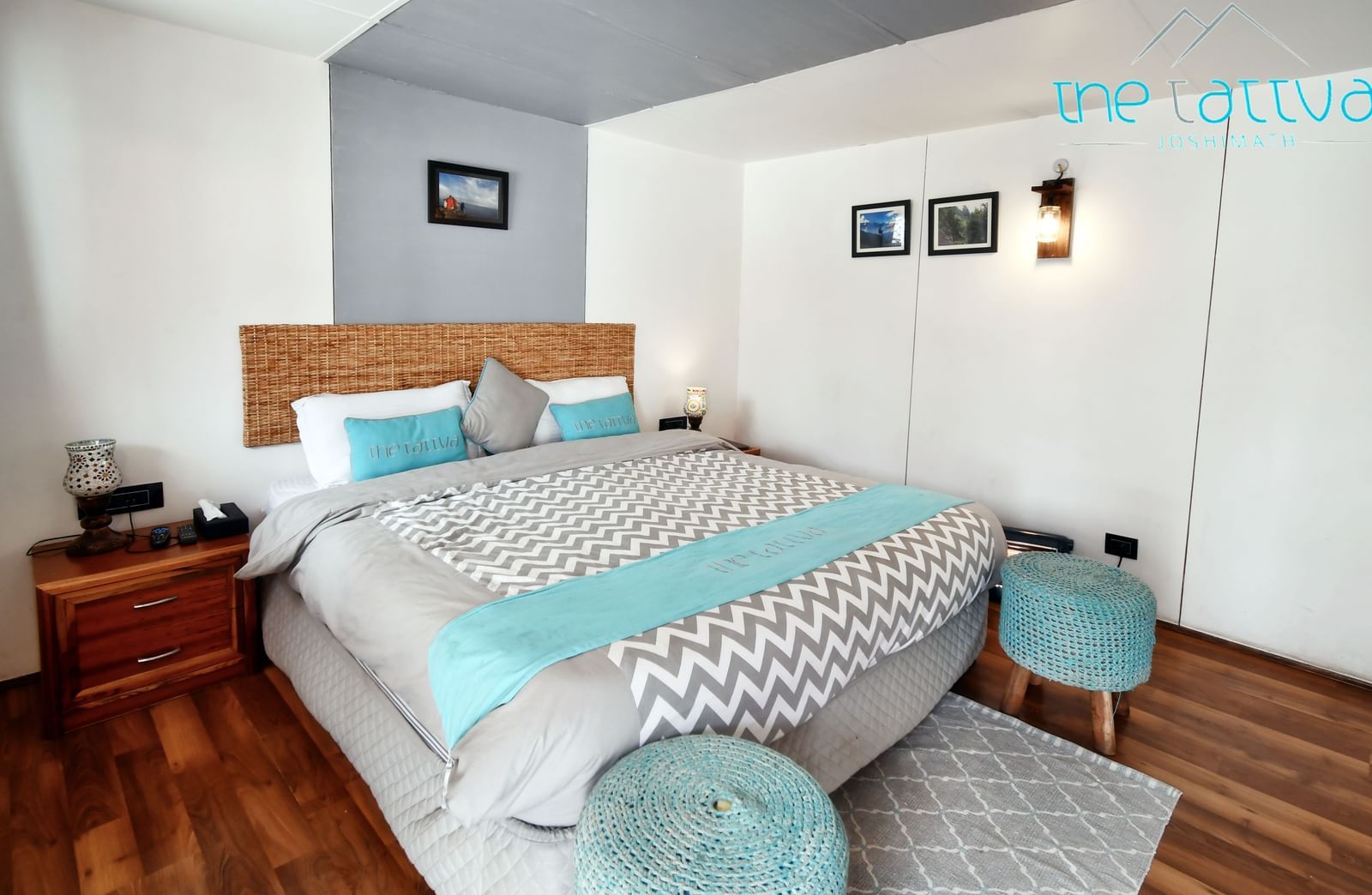 A deluxe room featuring a plus double bed with ample of natural light - The Tattva Boutique Resort