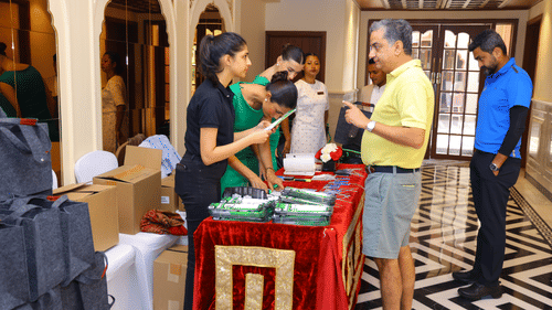 Guests registering at the hotel entrance for the Golf tournament.