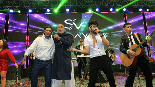 Live musical performance with a band entertaining guests on a vibrant stage.