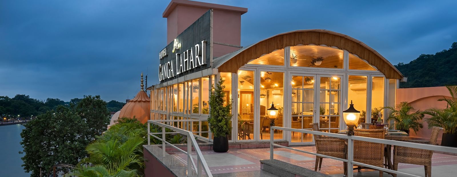 Scenic view of The Patio café entrance at dusk with the Ganges in the background, Haridwar.