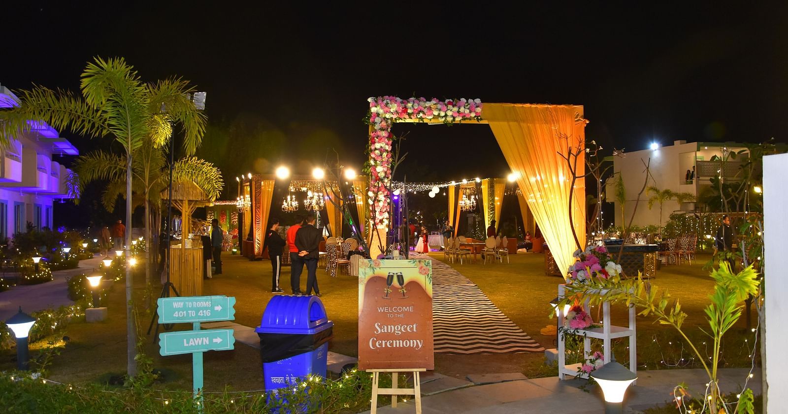 Nighttime entryway decor for a wedding event at Vedikant Resorts The Mallard Corbett.