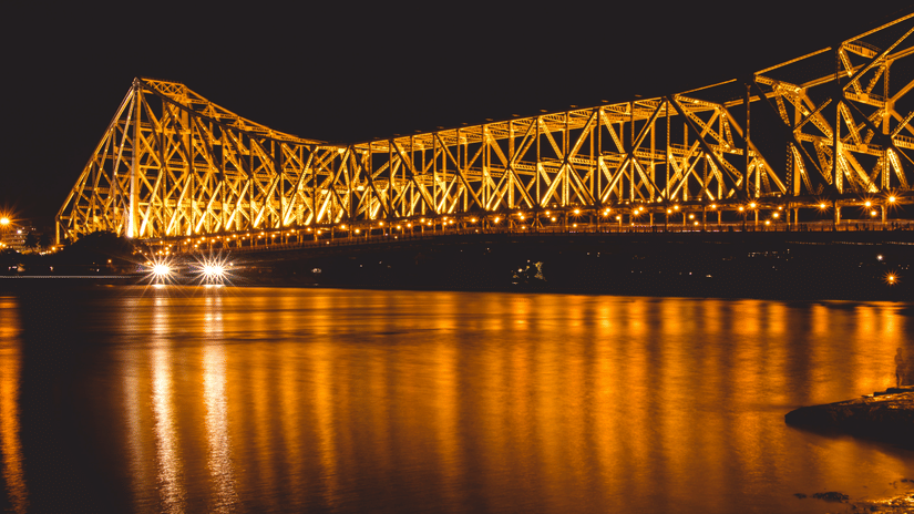 a bridge lit up at night 33