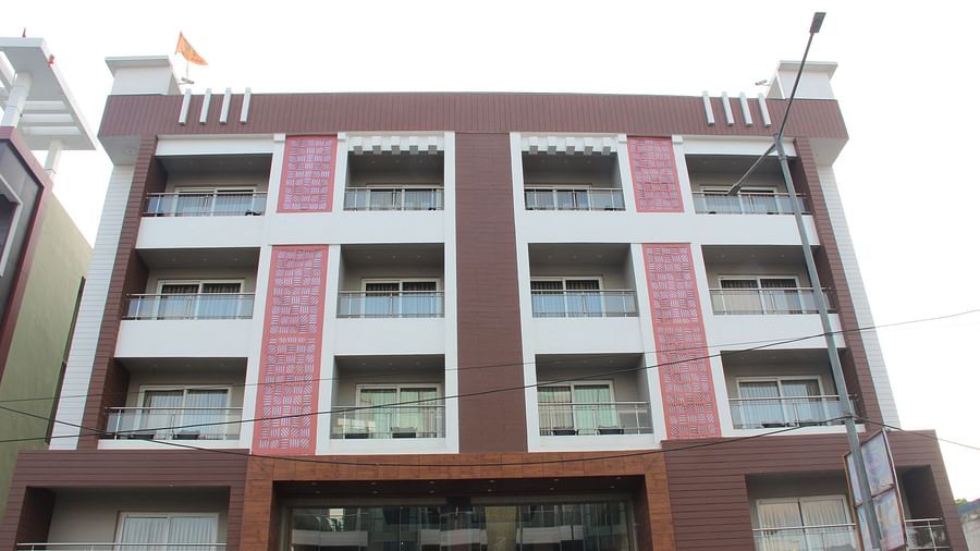 A facade view of Pride Biznotel Canopus Digha featuring four storeys and a main gate which is an entrance