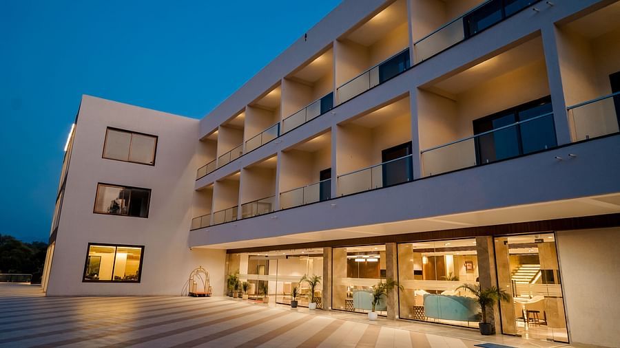 Pride Ranakpur Resort Convention Centre - Exterior view of the property facade at night time illuminated with yellow coloured lights