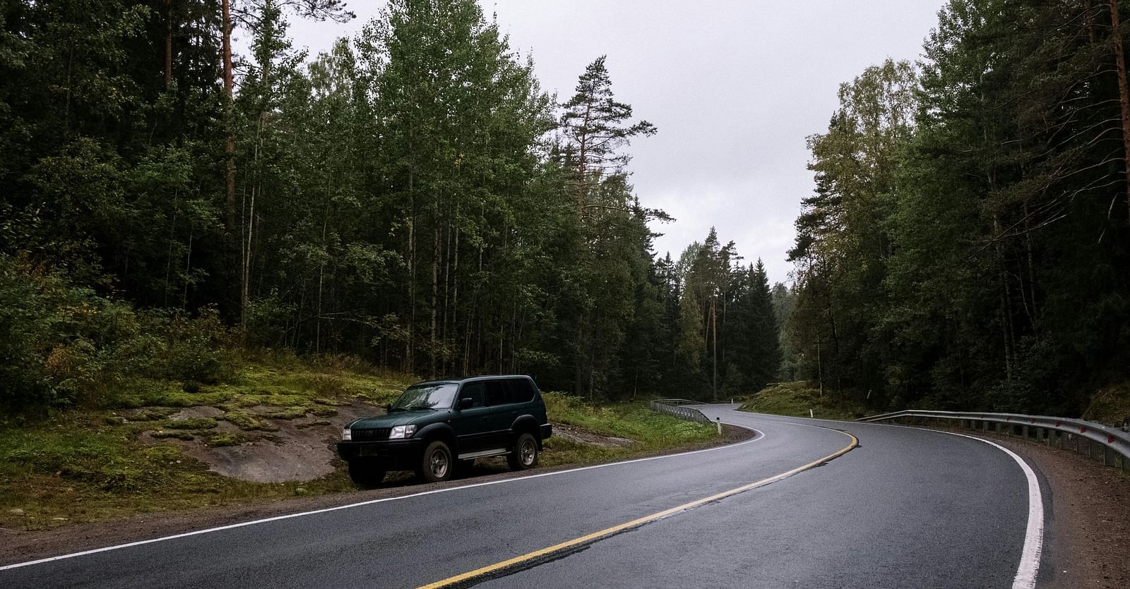 An image of a car parked at the side of the road | Ocean Sprays
