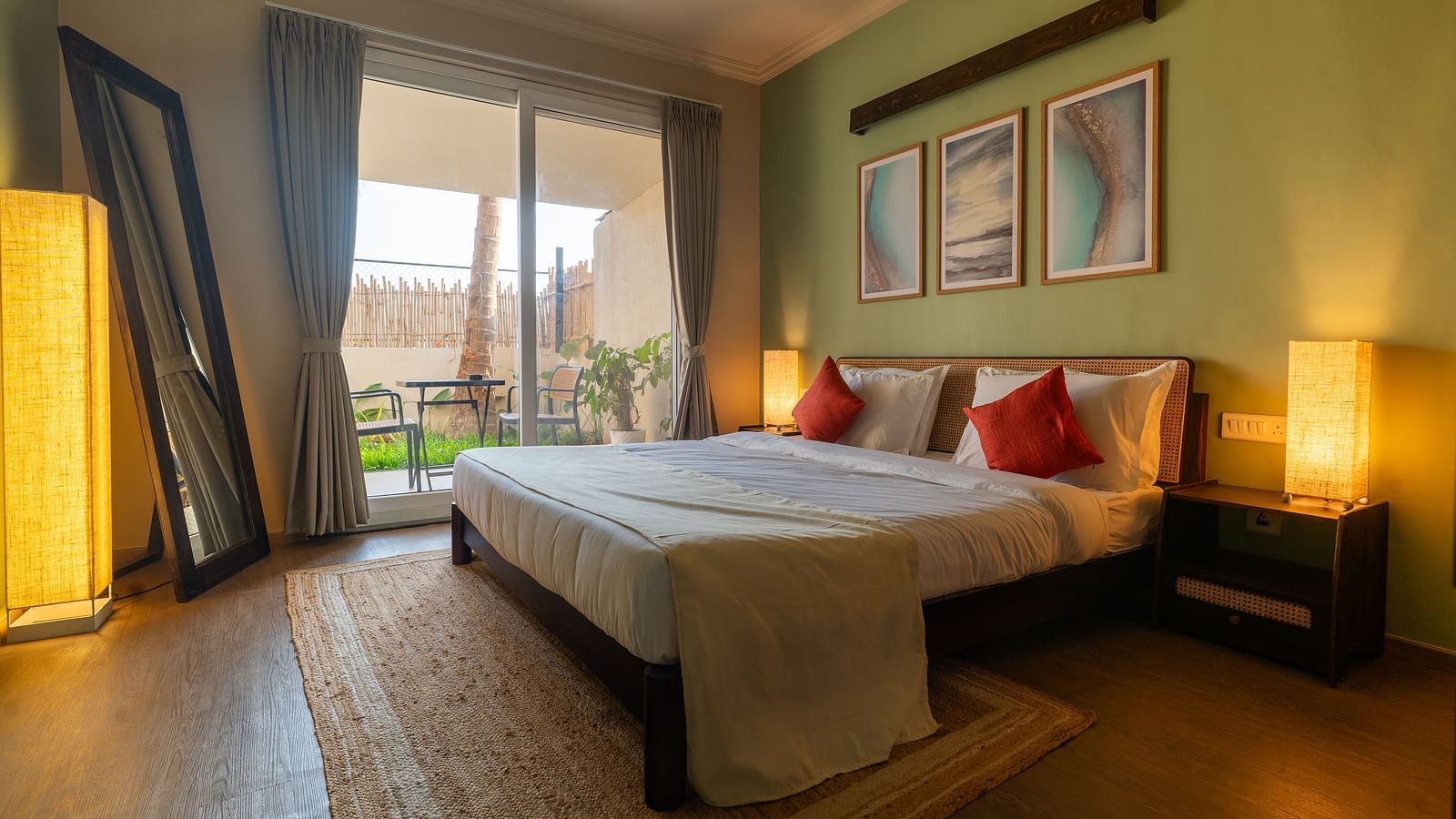 Bright and airy bedroom with double bed, contemporary decor, and access to balcony at Kssemya.