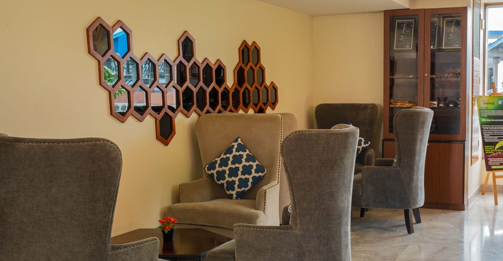 Image of the lounge area at Coral Reef Hotel and Spa in Port Blair featuring recliners and coffee tables