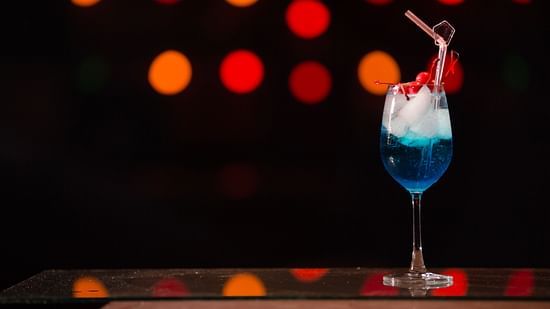 a blue drink on a table