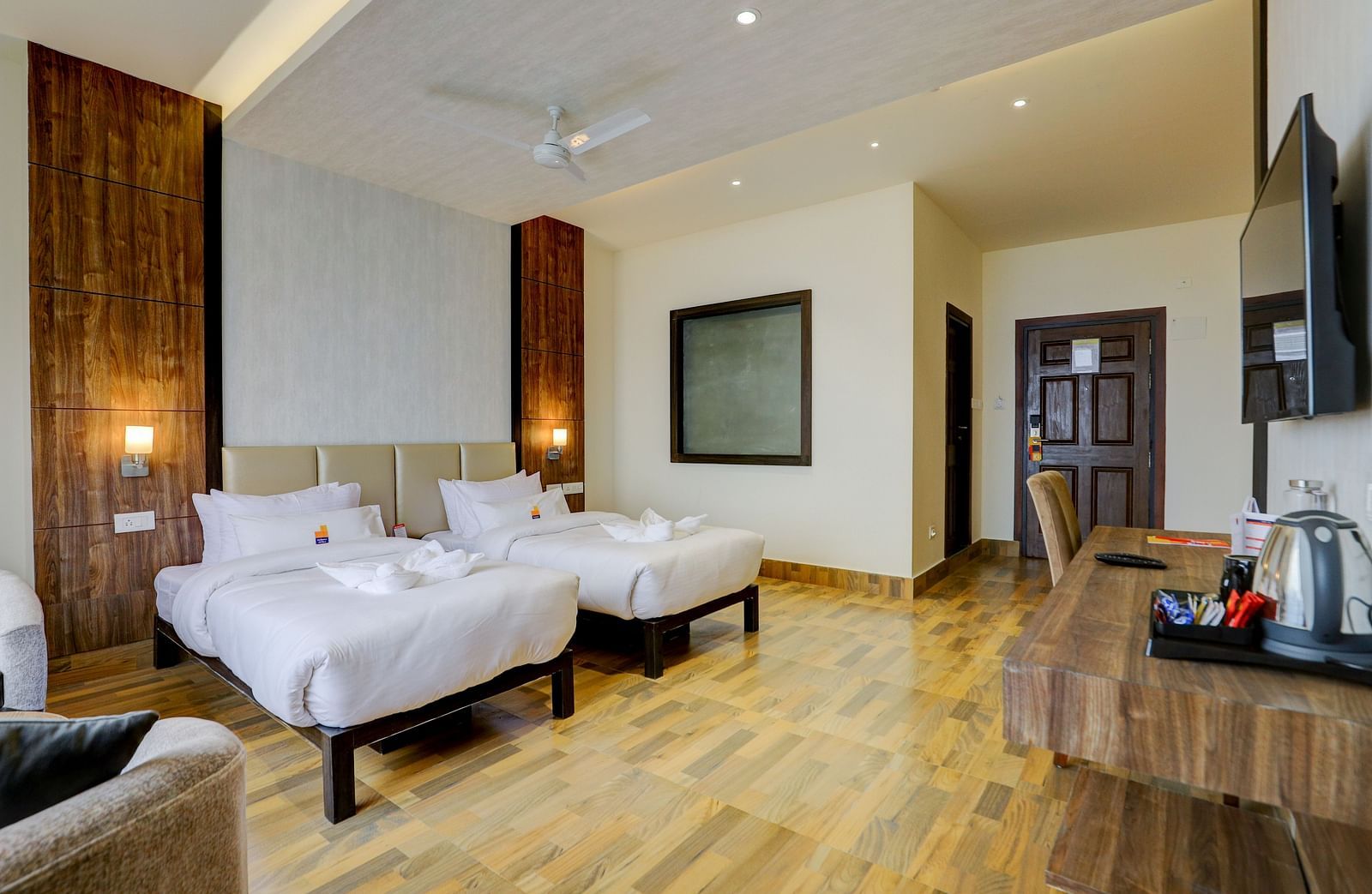view of twin beds and TV of a Premium Room at Banari Regency by Summit, Namchi