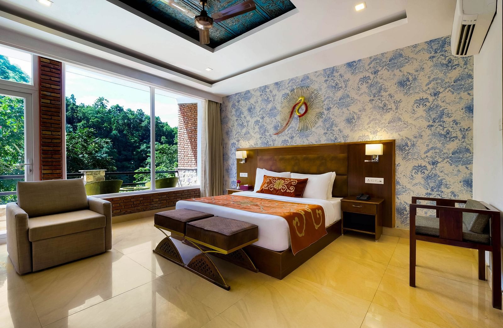 Side view of a room with bed and sitting area at Summit By The Ganges Beach Resort & Spa, Rishikesh