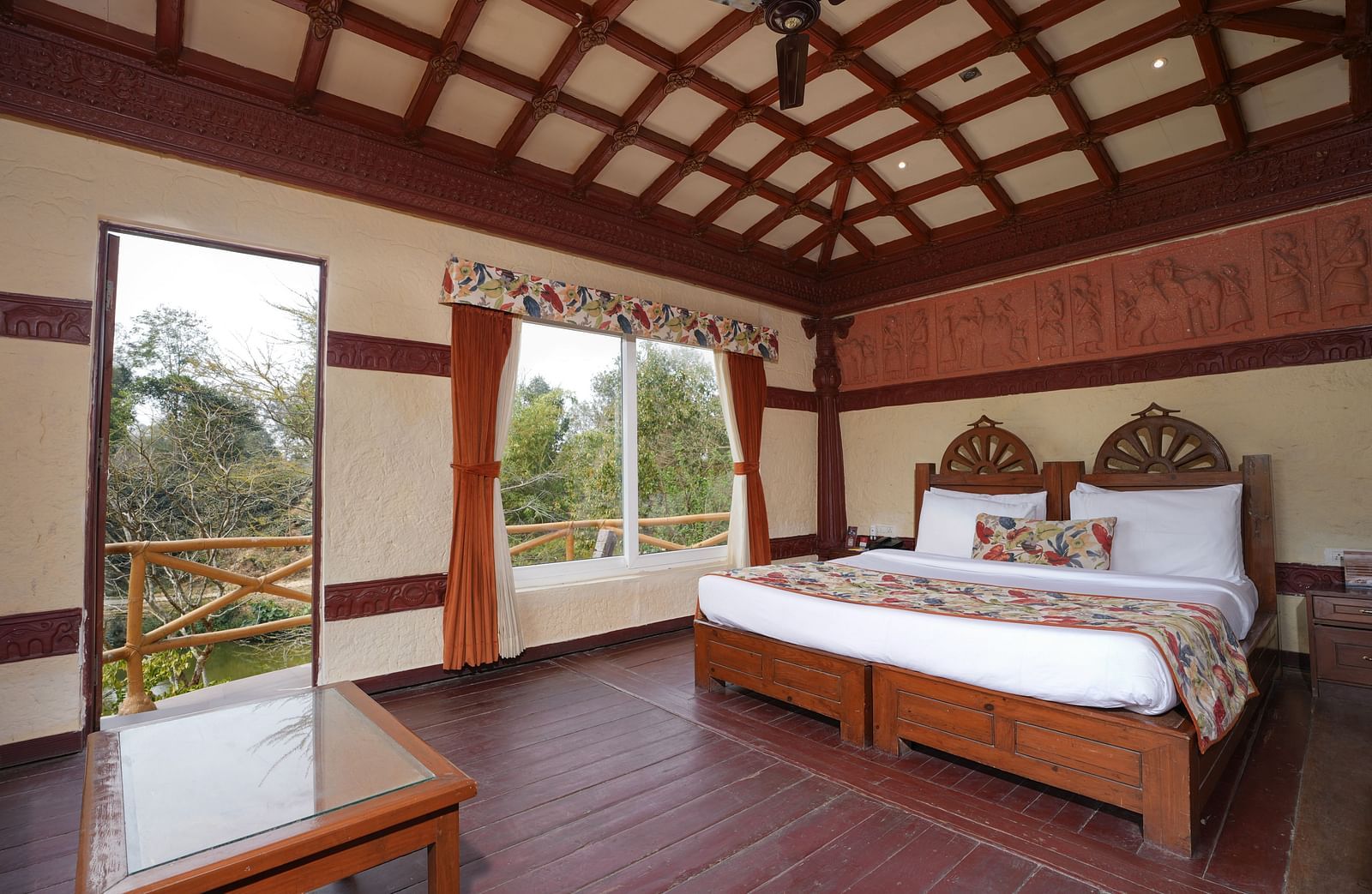 Ethnic villa offering a spacious bedroom and large windows with curtains at Summit Green Lake Tea Resort & Spa, Kaziranga