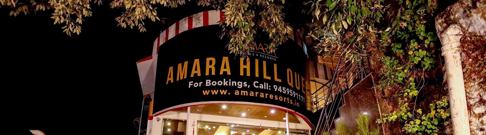 Image of a staircase with a signboard above that reads Amara - Amara Hill Queen, Mussoorie.