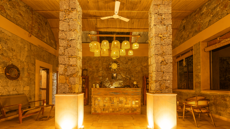  A reception with grand chandeliers, and lamps at KURJA Jawal.