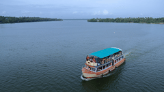 A houseboat going across a lake in Kerala