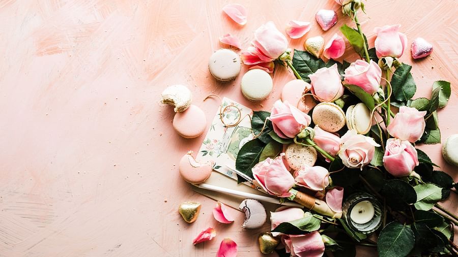 flowers, heart-shaped chocolates and macarons