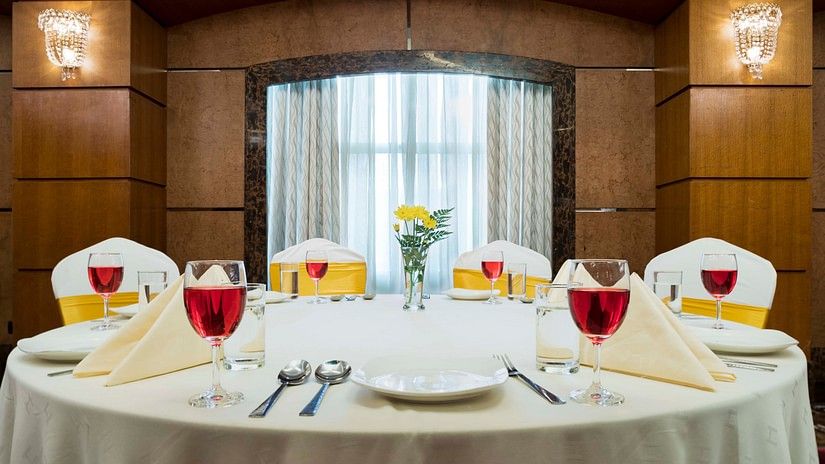 A dining table in magnum hall at Hablis Hotel, Chennai