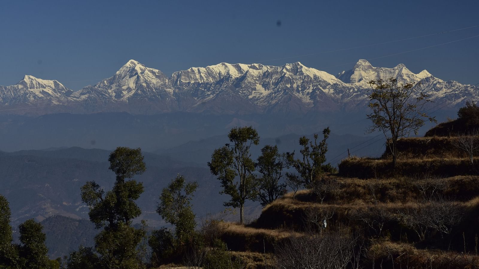 A farm at our resort in Almora with snow-capped Himalayas in the background - BluSalzz Escapade - Anant Rasa Resort