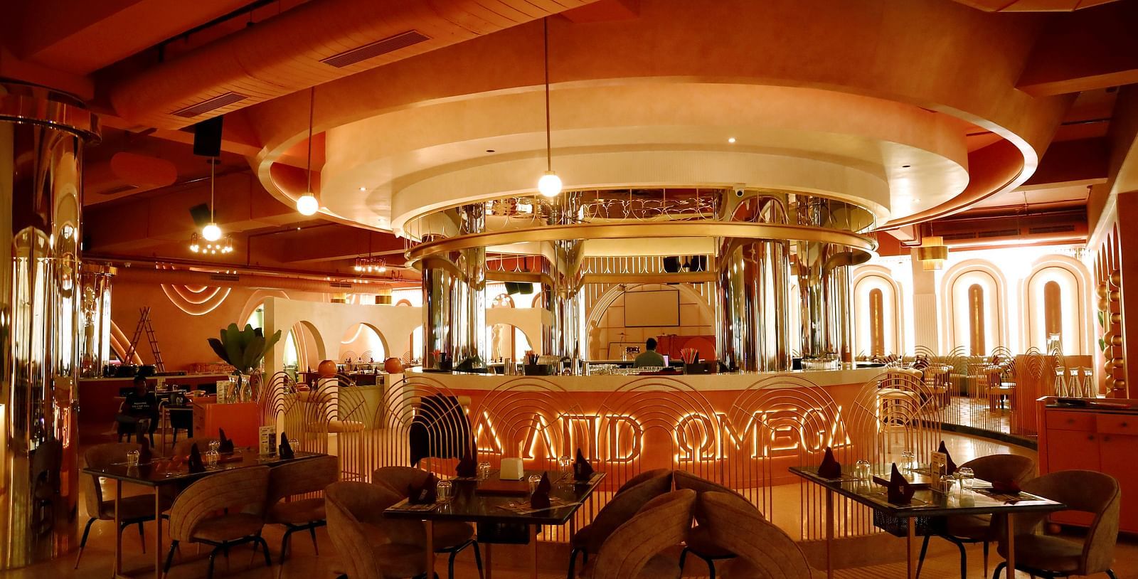 An image of a restaurant featuring a counter, and tables and chairs set at Themis Barbecue House, Ambala