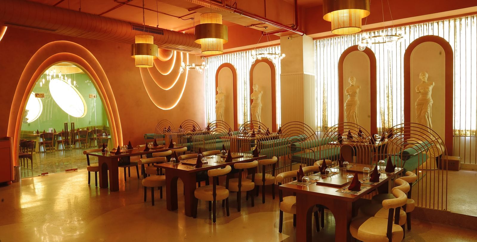 An image of a dining area featuring chairs and tables set placed everywhere in the room at Themis Barbecue House, Ambala