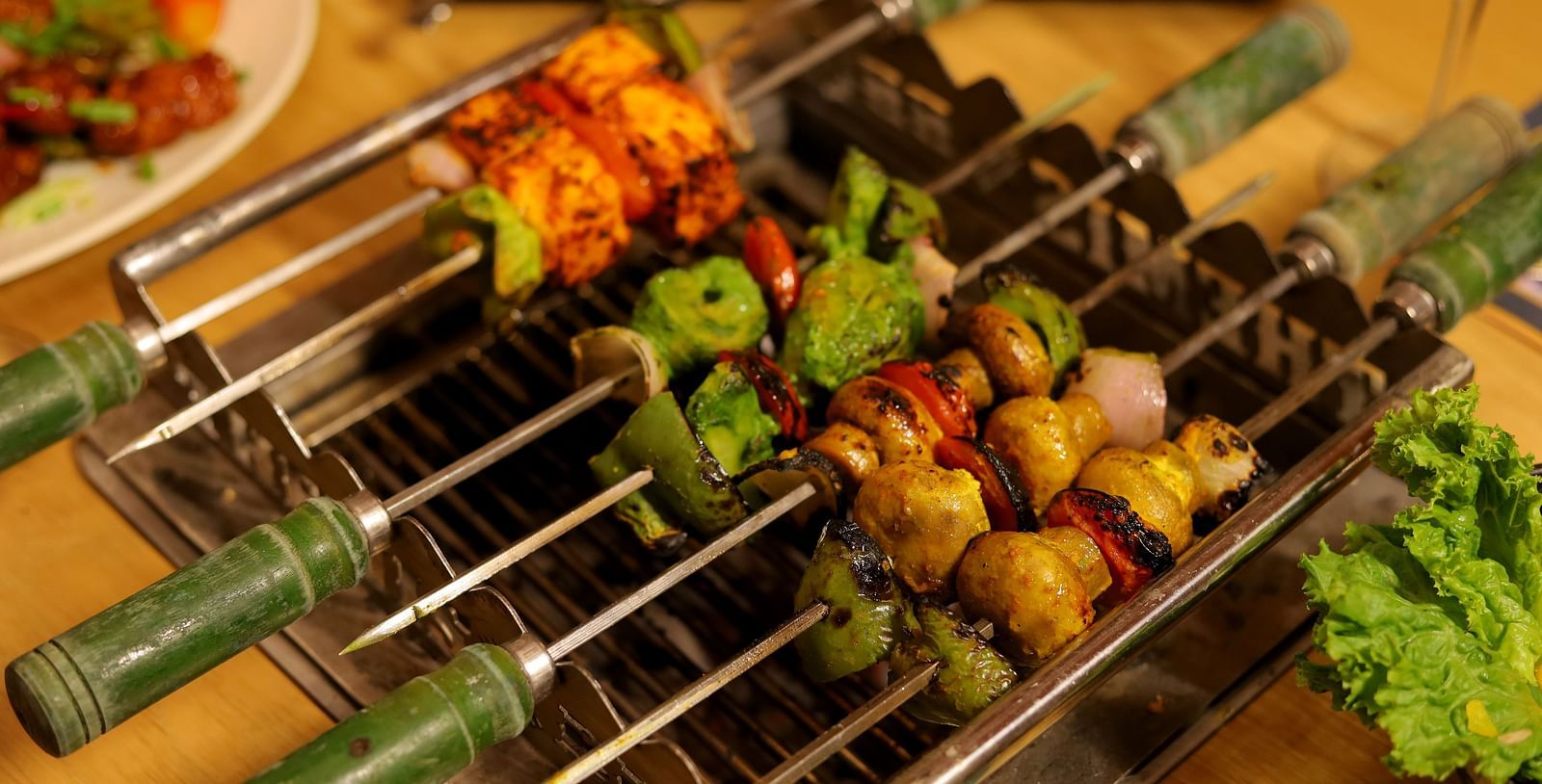 An image of skewers where meat is stuck at Themis Barbecue House, Ambala