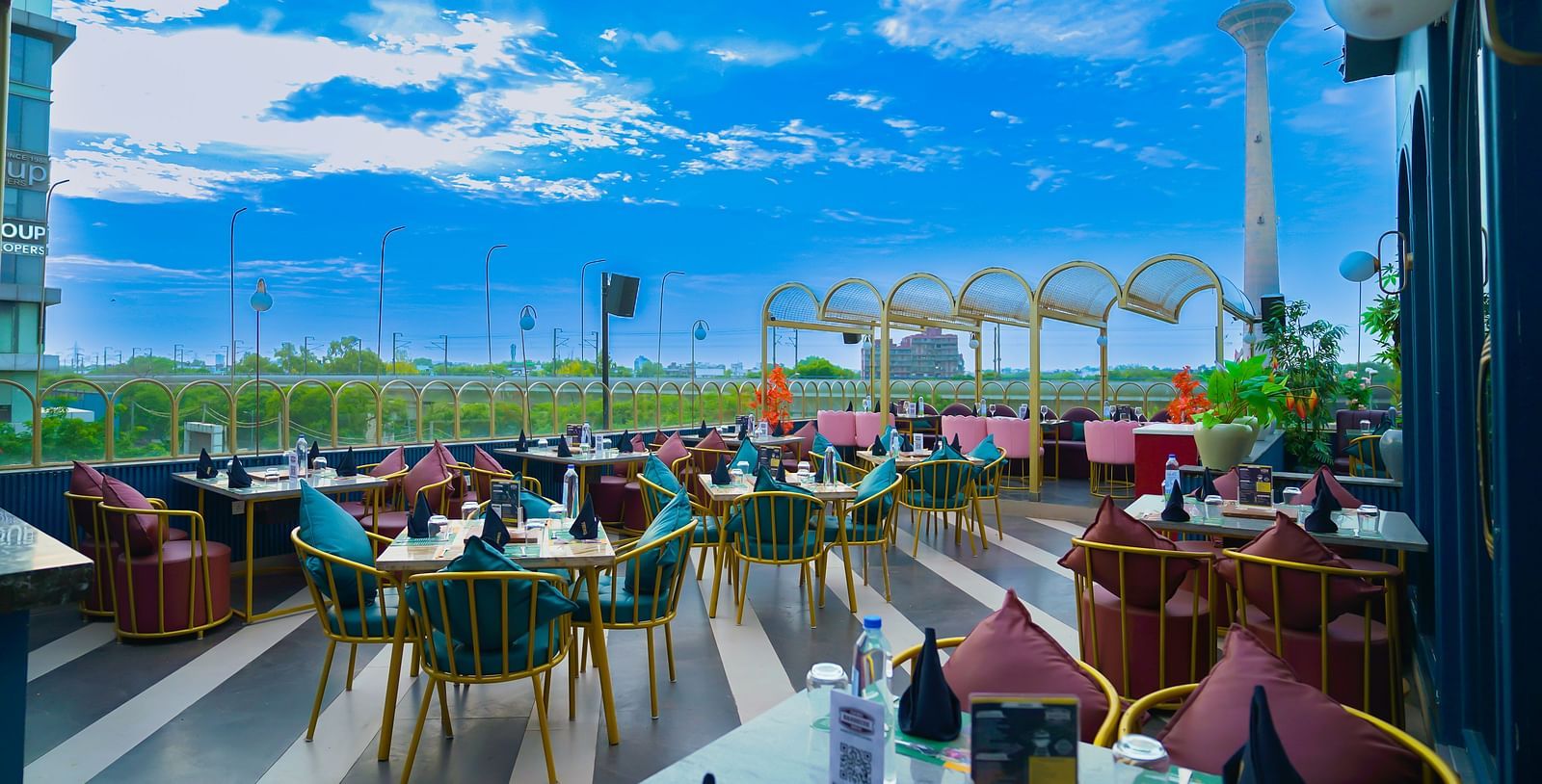An image of a seating arrangement on the rooftop at Themis Barbeque House