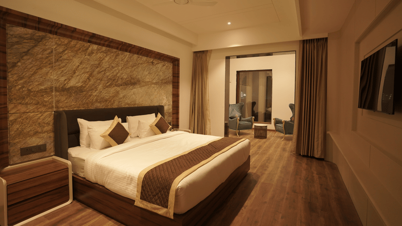 Superior room with king size bed and other amenities at Classic Sapphire by Ananta