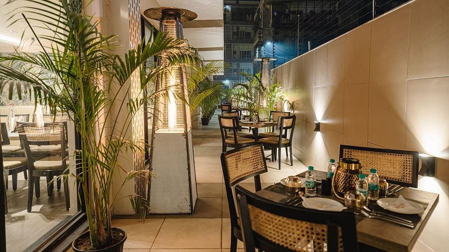 outdoor seating area at Mishri, the restaurant at Triptam Hotel, Vrindavan