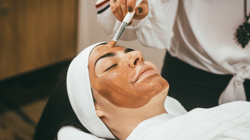 A woman receives facial therapy