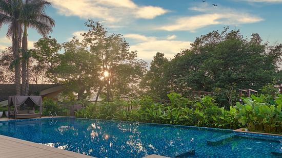 sunset view by the pool, with vibrant colours reflecting on the water at The Dukes Retreat