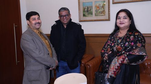 An image of three people smiling at the camera at Heritage Village Resorts & Spa