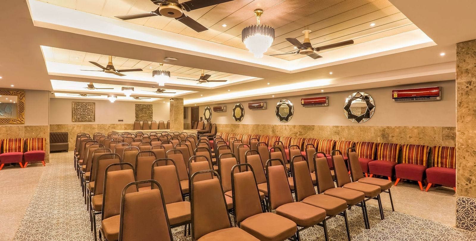 A shot of brown chairs at the banquet hall in Summit arranged systematically for an corporate event.