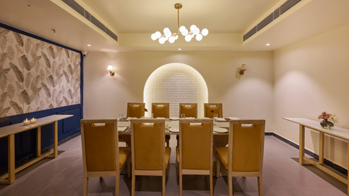 table for eight in the private dining room of Flavours all day dining at ABN Sarovar Portico, Jim Corbett
