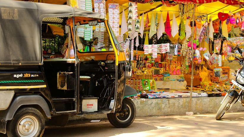 Auto standing in front of shop 