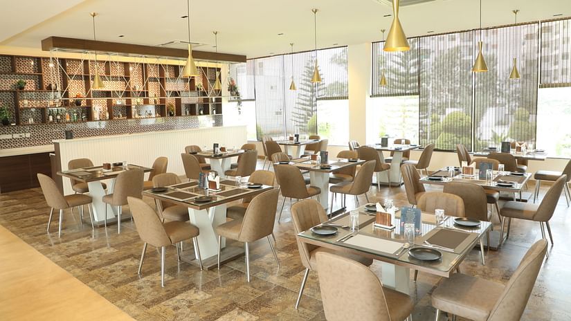 Brown tables and chairs in a restaurant dining area